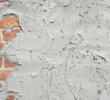 Tiiliseinän rappaus: Laastia heitetään seinään, kunnes se peittyy kokonaan Tiiliseinän rappaus: Laastia heitetään seinään, kunnes se peittyy kokonaan